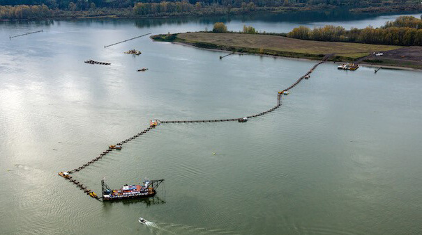 Bird's-eye view of a dredging vessel on the water