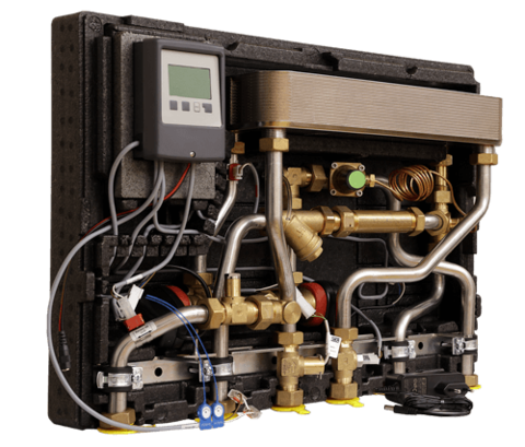 Watts HIU Heat Comfort E heat interface unit, internal view with plate heat exchanger, circulator pumps, brass valves, and LCD controller, left-side front perspective.
