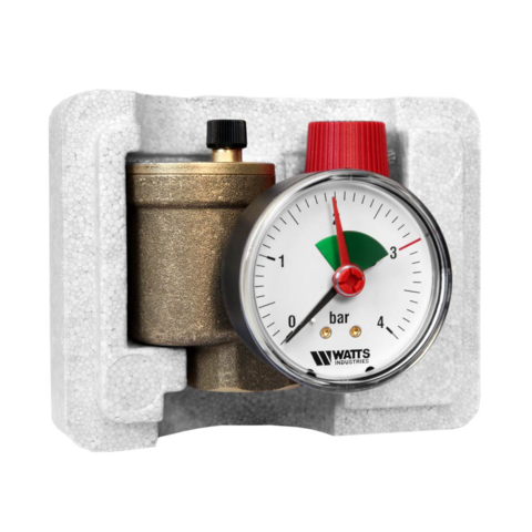 Watts KSG-30N boiler safety group up to 50 kW, compact design with visible rear insulating shell, integrated pressure gauge, automatic air vent and red 3-bar safety valve, angled front view.c