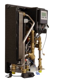Watts HIU Heat Comfort Compact E heat interface unit, compact vertical design with plate heat exchanger, circulator pump, brass valves and LCD controller, left-side front perspective.